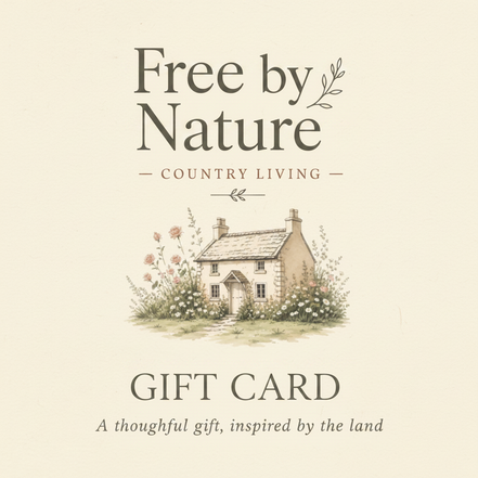 Free by Nature gift card design with the Free by Nature Country Living logo and cottage illustration on a warm cream background